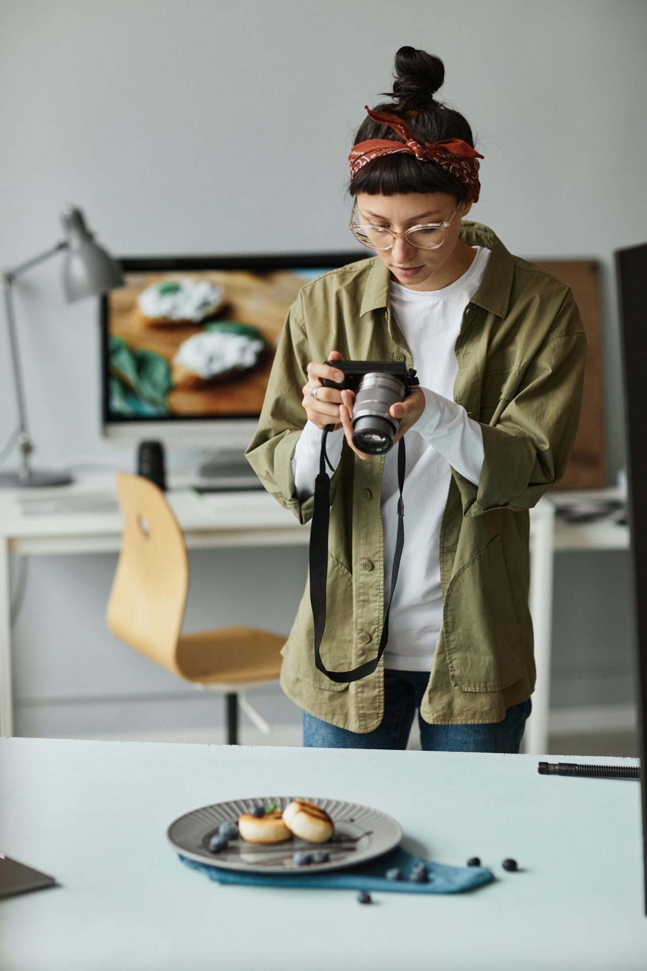 female photographer taking pictures of food.jpg