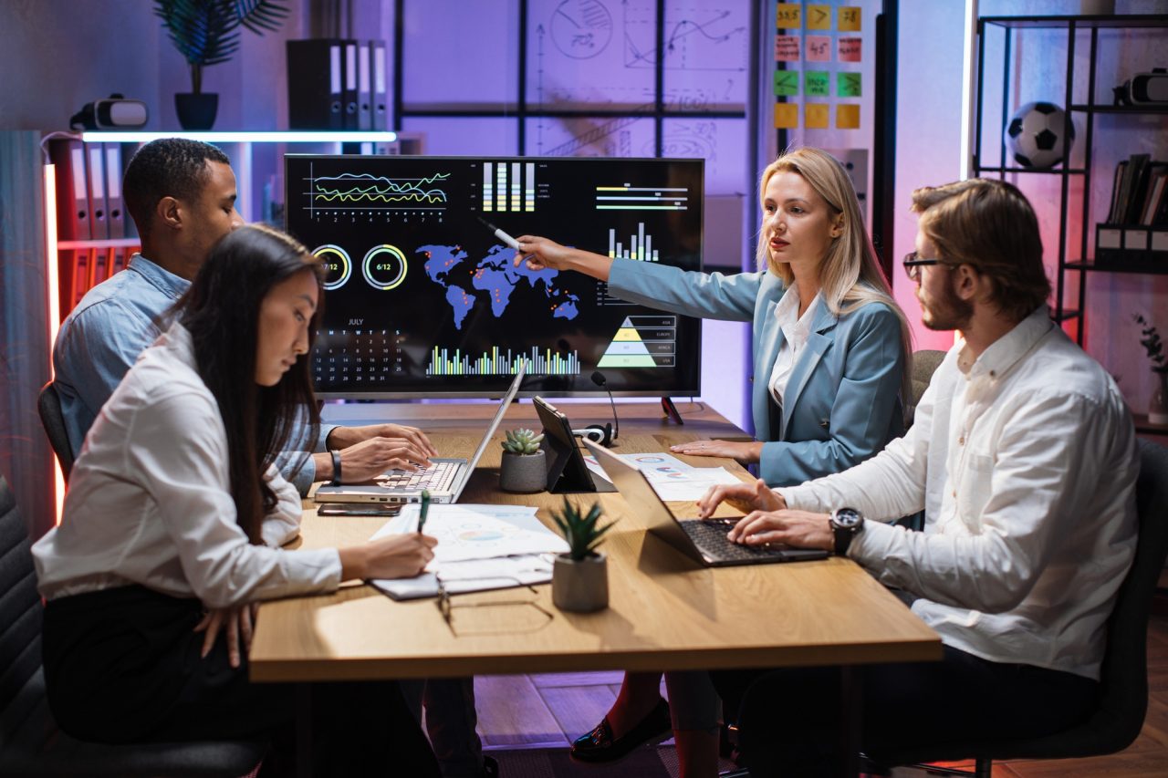 multiracial partners discussing financial project at office.jpg